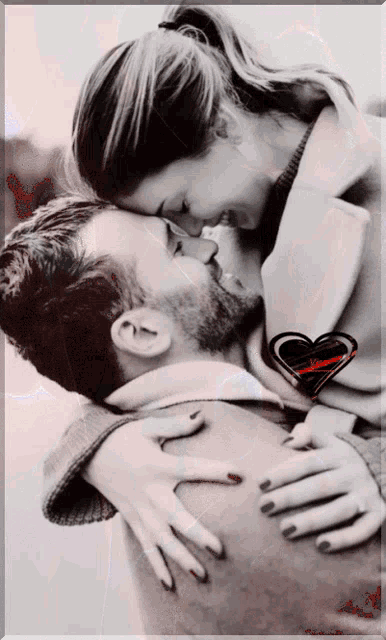 a black and white photo of a man and a woman hugging