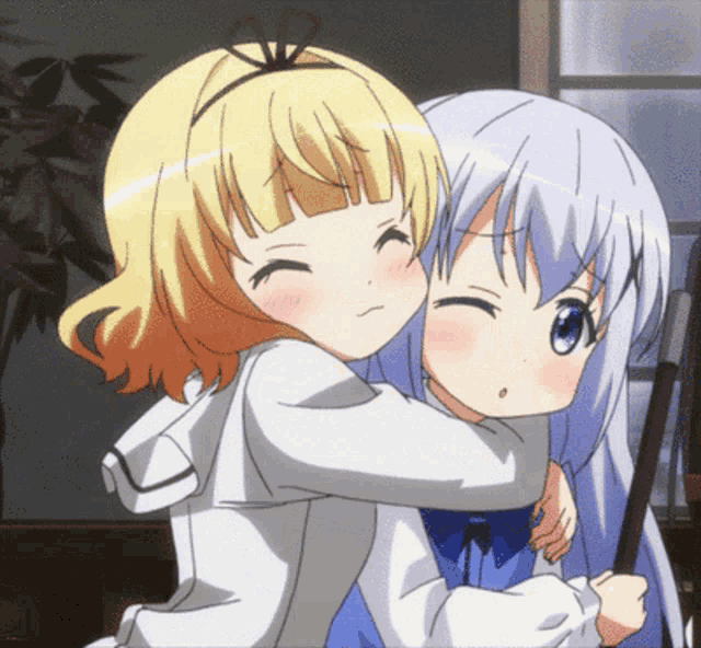 two anime girls are hugging each other and one has a bow in her hair