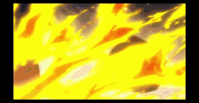 a close up of a fire with a lot of flames coming out of it