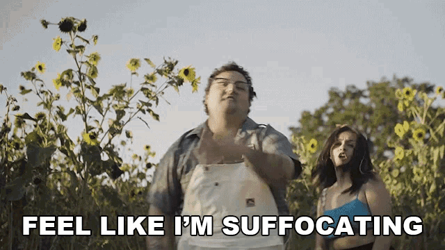 a man and a woman standing in a field with the words feel like i 'm suffocating above them