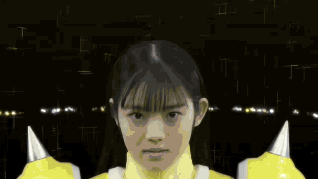 a close up of a girl 's face with a light coming out of her eyes