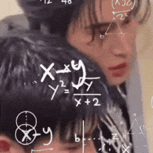 a man and a woman looking at a chalkboard with math equations on it