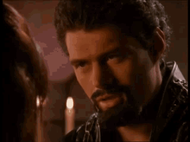 a man with a beard is talking to a woman and the words are you really having more fun these days are above him
