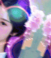 a close up of a woman 's face in a pixelated image with flowers in the background .