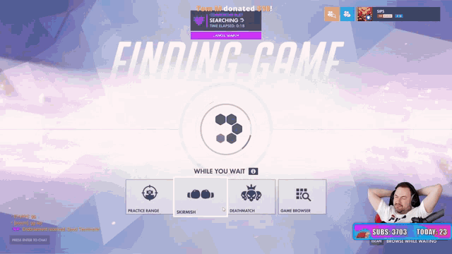 a man sits in front of a computer screen that says finding game