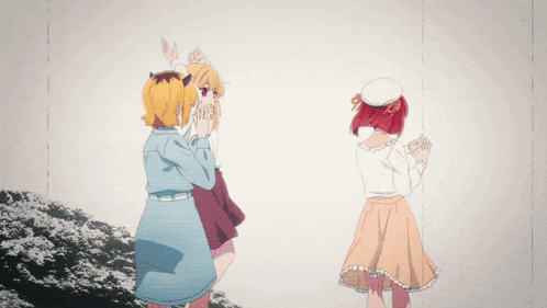 three anime girls are standing next to each other and one has a cat on her head