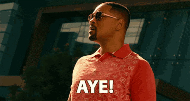 a man in a red shirt says aye