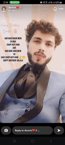 a man in a suit and tie says happy birthday on his phone