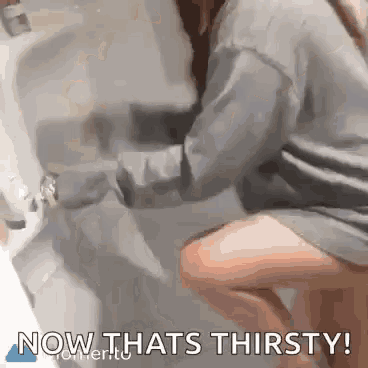 a woman is washing her hands in a bathroom sink with the words now thats thirsty