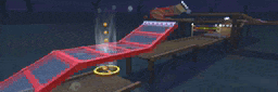 a video game scene with a red ramp and a yellow circle in the middle