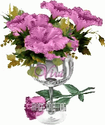 purple flowers in a wine glass with the word " viva " on it