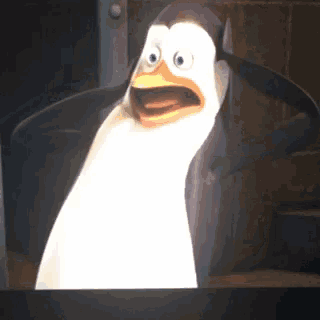 a cartoon penguin with a surprised look on its face