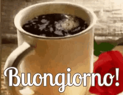 a cup of coffee and a red rose with the words buongiorno