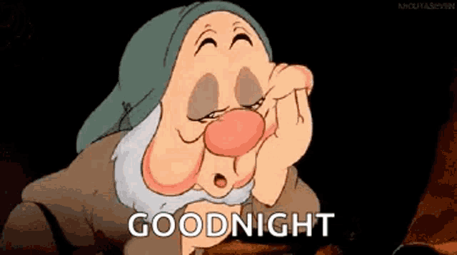 a cartoon character from snow white and the seven dwarfs is yawning and says goodnight .