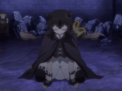 a girl in a black cape with a cross on her chest
