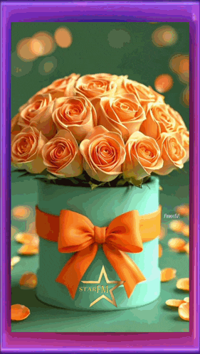 a bouquet of orange roses in a blue box with a star fm logo on it