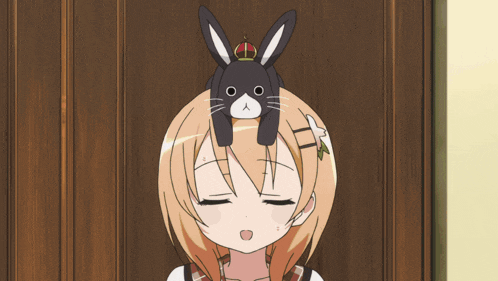 a girl in a maid outfit is holding a plate in her hands