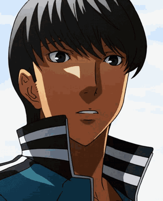 a close up of a person 's face with a blue jacket