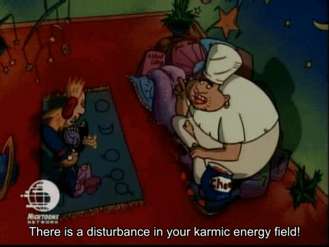 a cartoon of a man laying on the floor with the words " there is a disturbance in your karmic energy field "