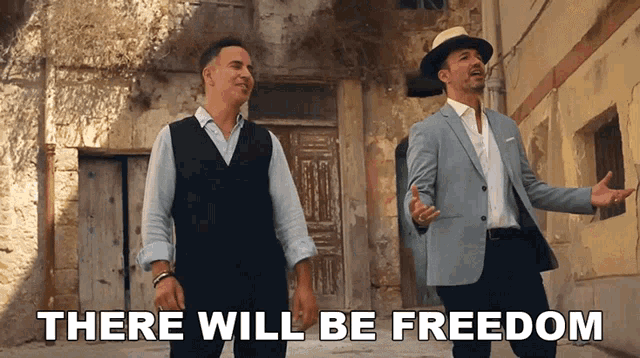 two men standing next to each other with the words " there will be freedom " on the bottom