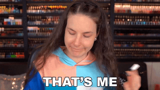 a woman says that 's me while holding something