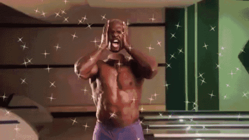 a shirtless man in purple shorts is surrounded by sparkly stars