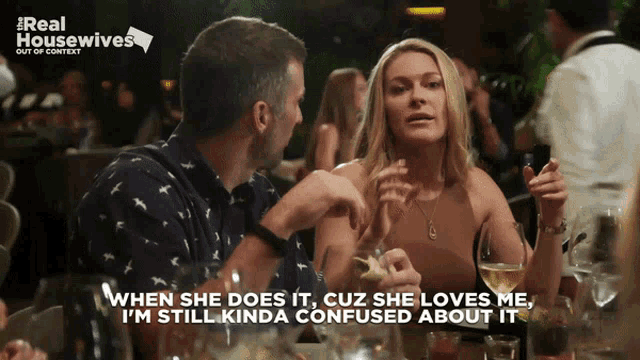 a poster for real housewives shows a man and woman talking