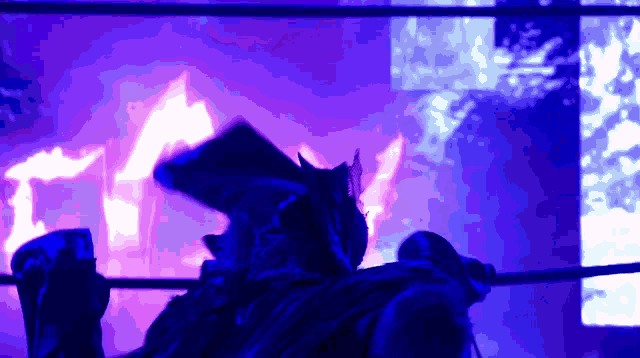 a person in a boxing ring with a blue background