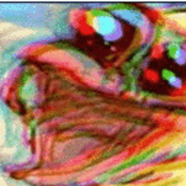 a close up of a colorful painting of a person 's face .