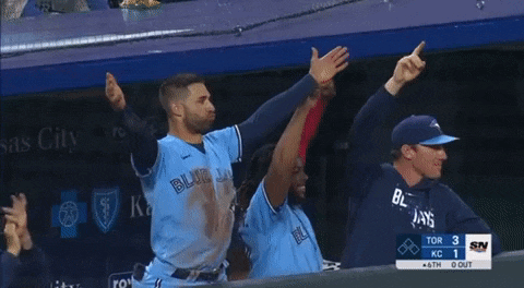 a group of blue jays baseball players are celebrating