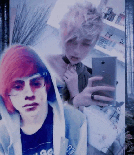 a boy with red hair is taking a selfie with a girl with white hair .