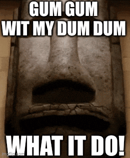 a statue of a face with the words gum gum wit my dum dum what it do !