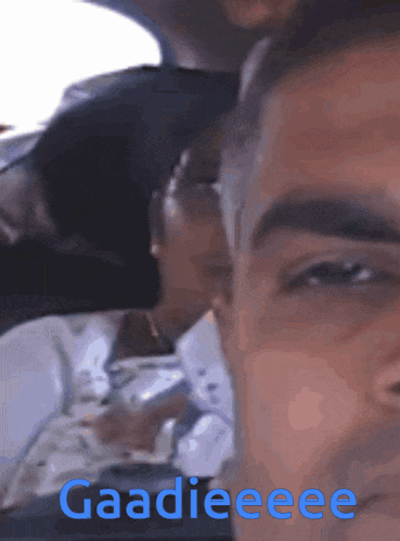 a close up of a man 's face with the words gaadieeee written on it
