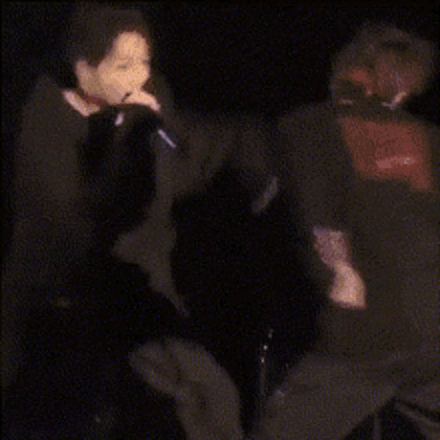 a blurry picture of a man in a black jacket