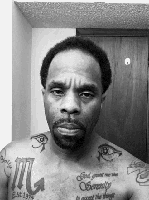 a man has a tattoo on his chest that says god grant me the serenity