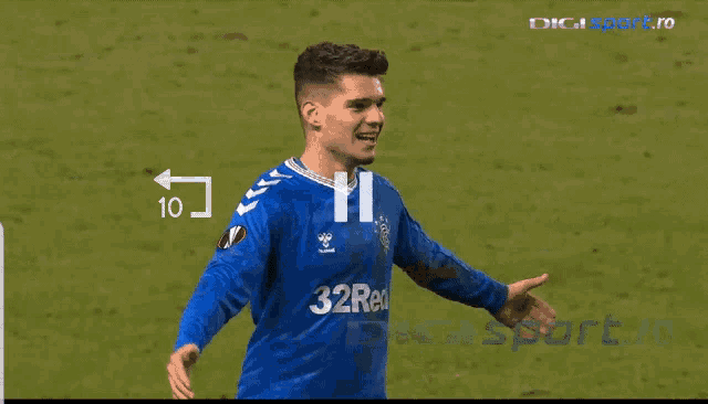 a soccer player wearing a blue jersey with the number 22 on it