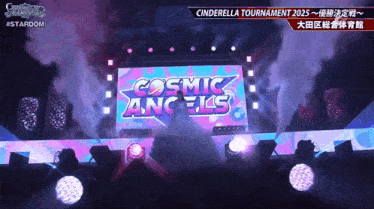 a cosmic angels sign is displayed on a stage
