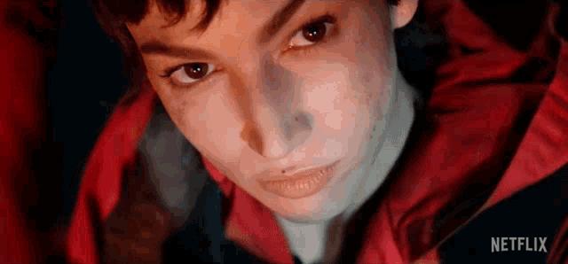 a close up of a person 's face with netflix written on the bottom .