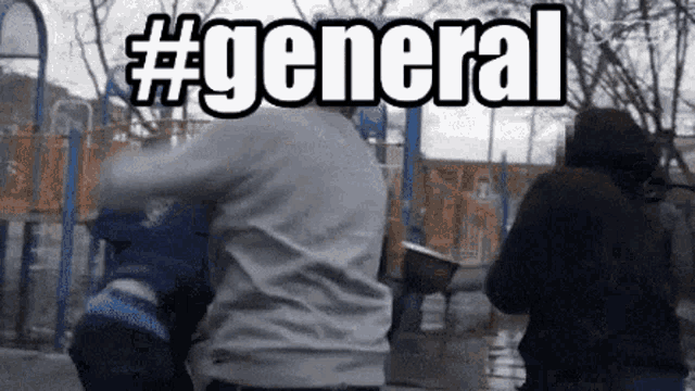 a group of people are standing in front of a playground with the word general written in white letters
