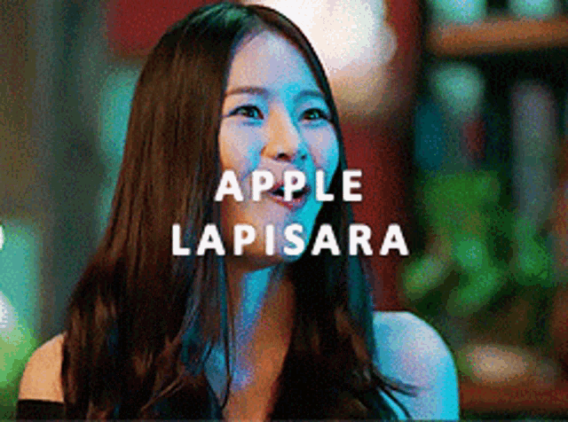 a woman with long hair is smiling with the words apple lapisara written above her