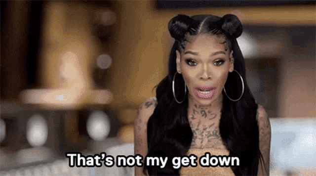 a woman is saying that 's not my get down while wearing hoop earrings .