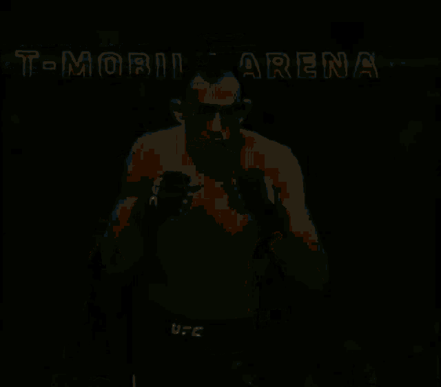 a ufc fighter is standing in front of a sign that says t-mob arena