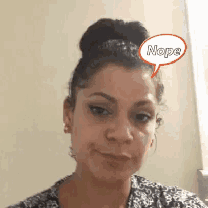 a woman with a bun and a speech bubble that says nope on her forehead