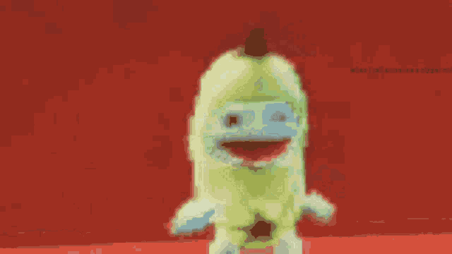 a cartoon character is standing on a red surface with a red background