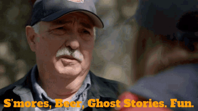 a man in a baseball cap is talking to another man with the words " s'mores beer ghost stories fun " on the bottom