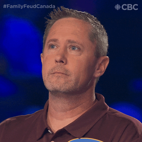 a man with a beard and a maroon shirt is on a cbs show called family feud canada