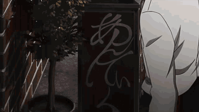 a person is standing in front of a sign that says ' r ' on it