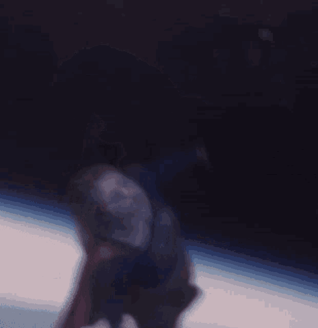 a woman in a superman costume is flying in the air