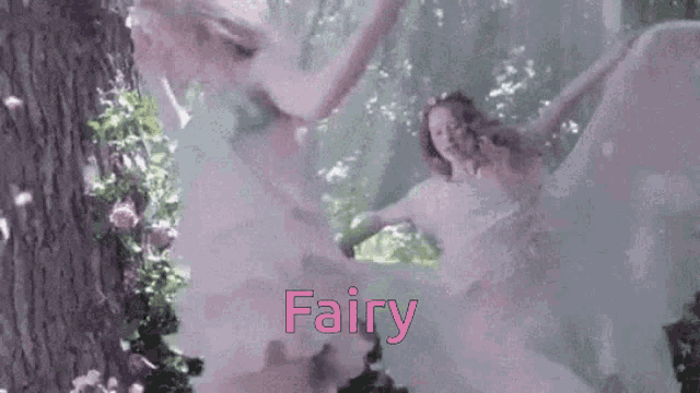 a woman in a white dress is dancing in a forest with the word fairy in pink .