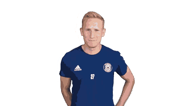 a man wearing a blue adidas shirt is giving a thumbs up